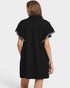 Black dress with white trim on a plain background