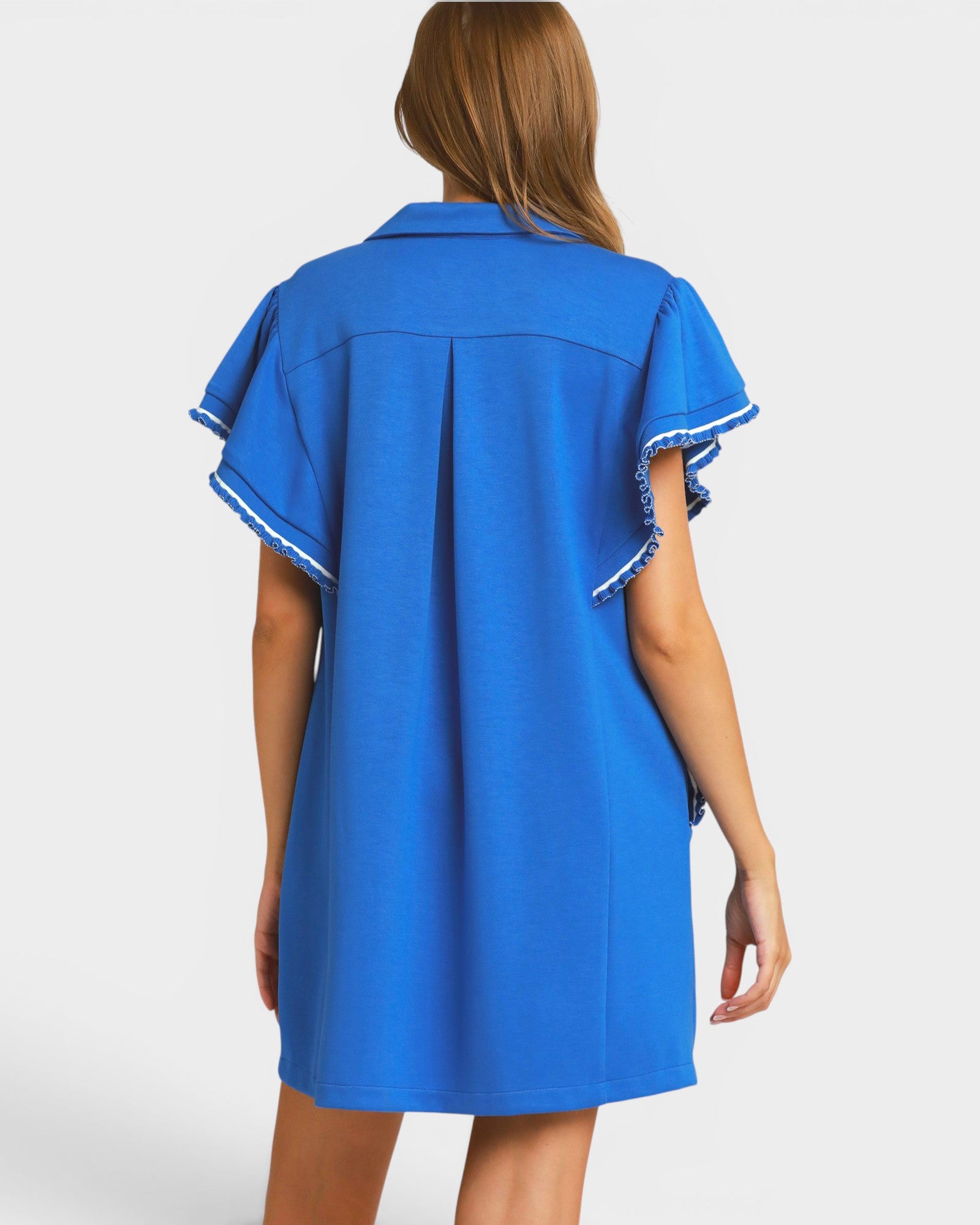 Blue dress with white trim on a plain background