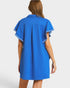 Blue dress with white trim on a plain background