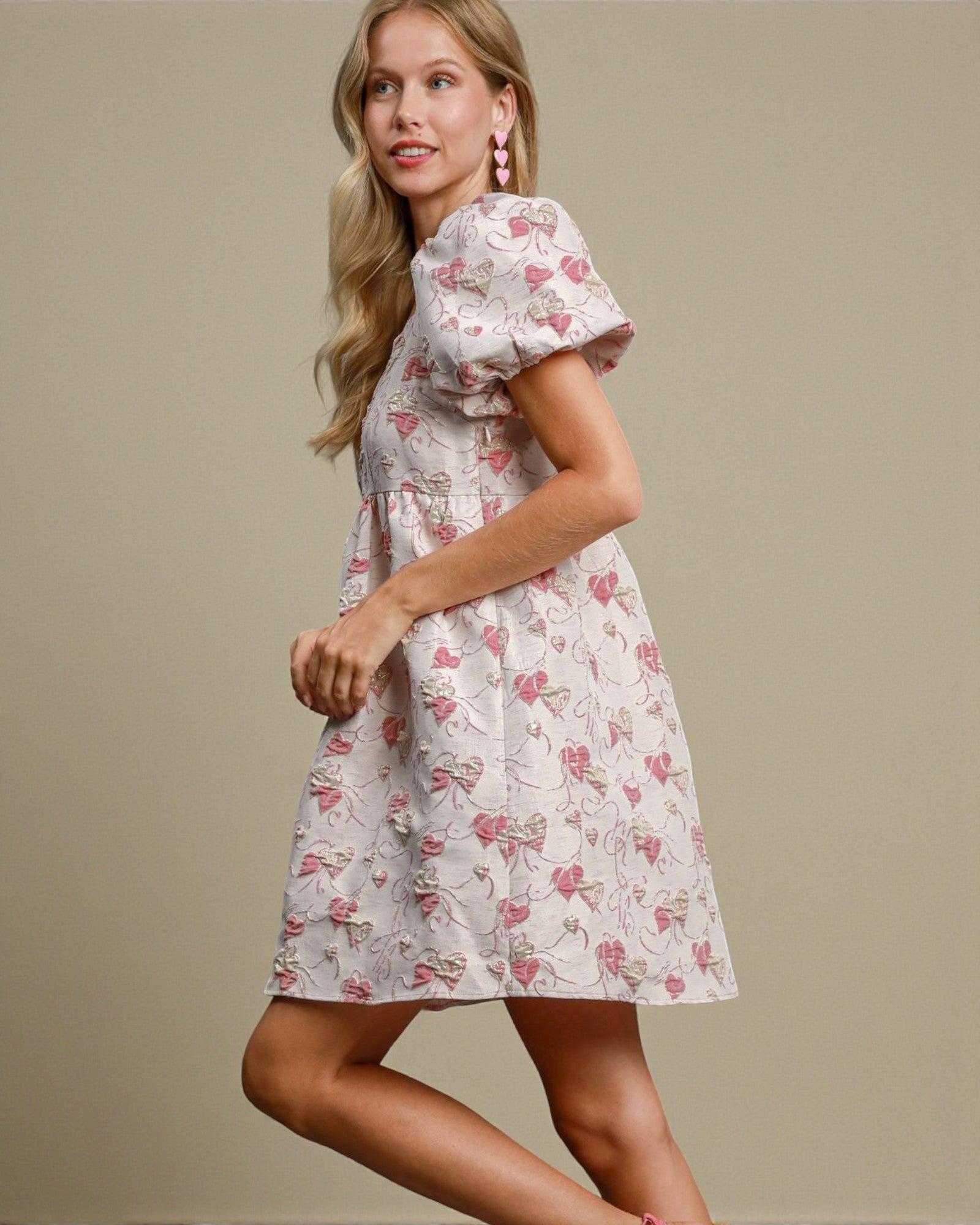 Woman wearing a floral dress against a beige background