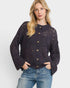 Woman wearing a dark navy open-knit cardigan with gold buttons on a white background