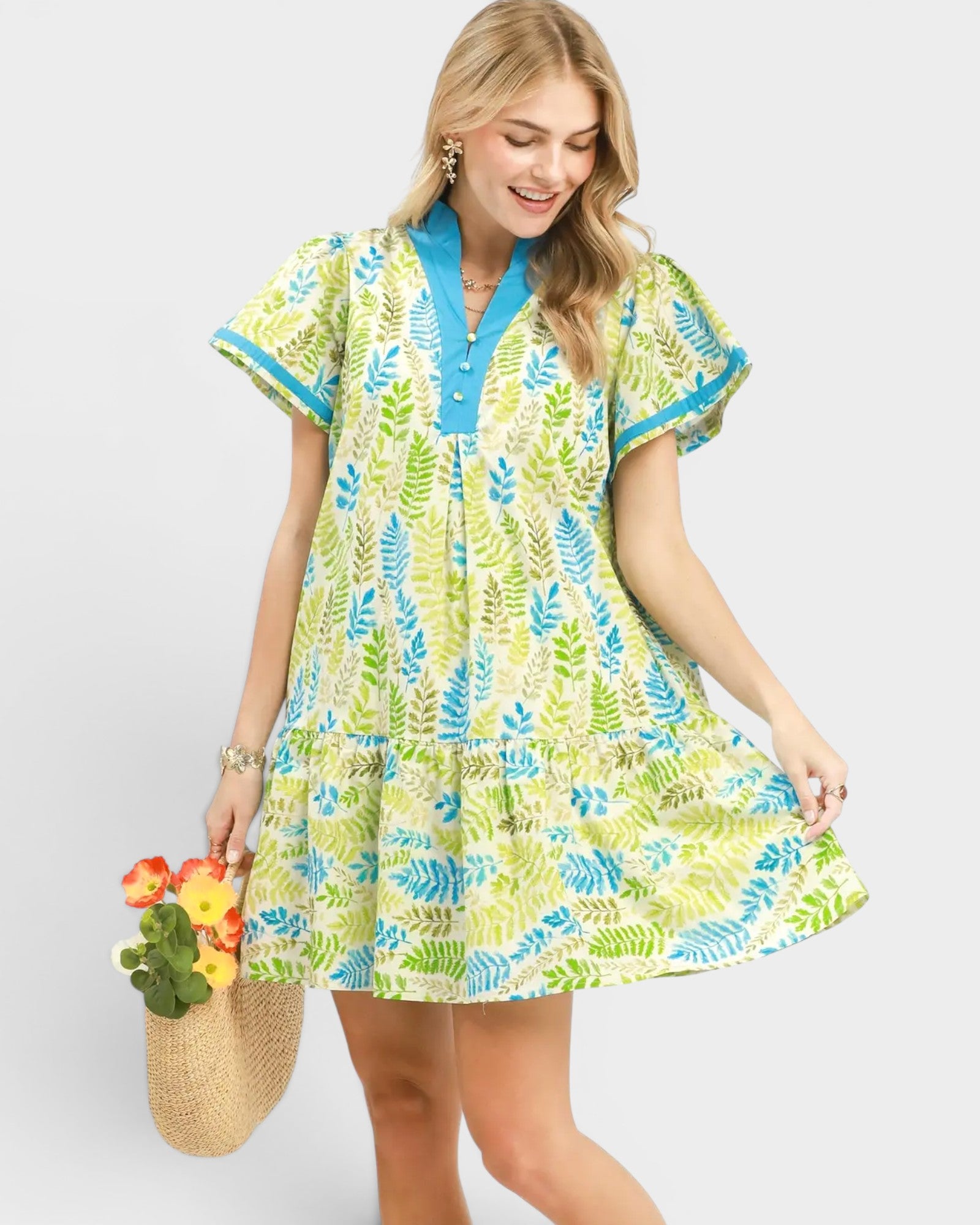 Woman wearing a colorful dress with a white background