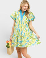 Woman wearing a colorful dress with a white background