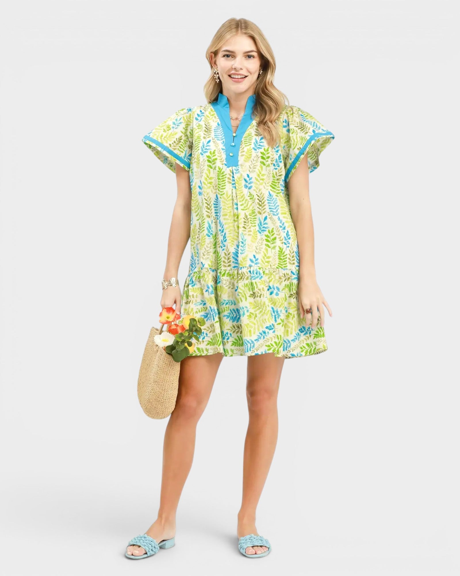 Woman wearing a colorful dress with a white background