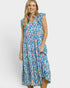 Woman wearing a blue and pink floral dress on a white background