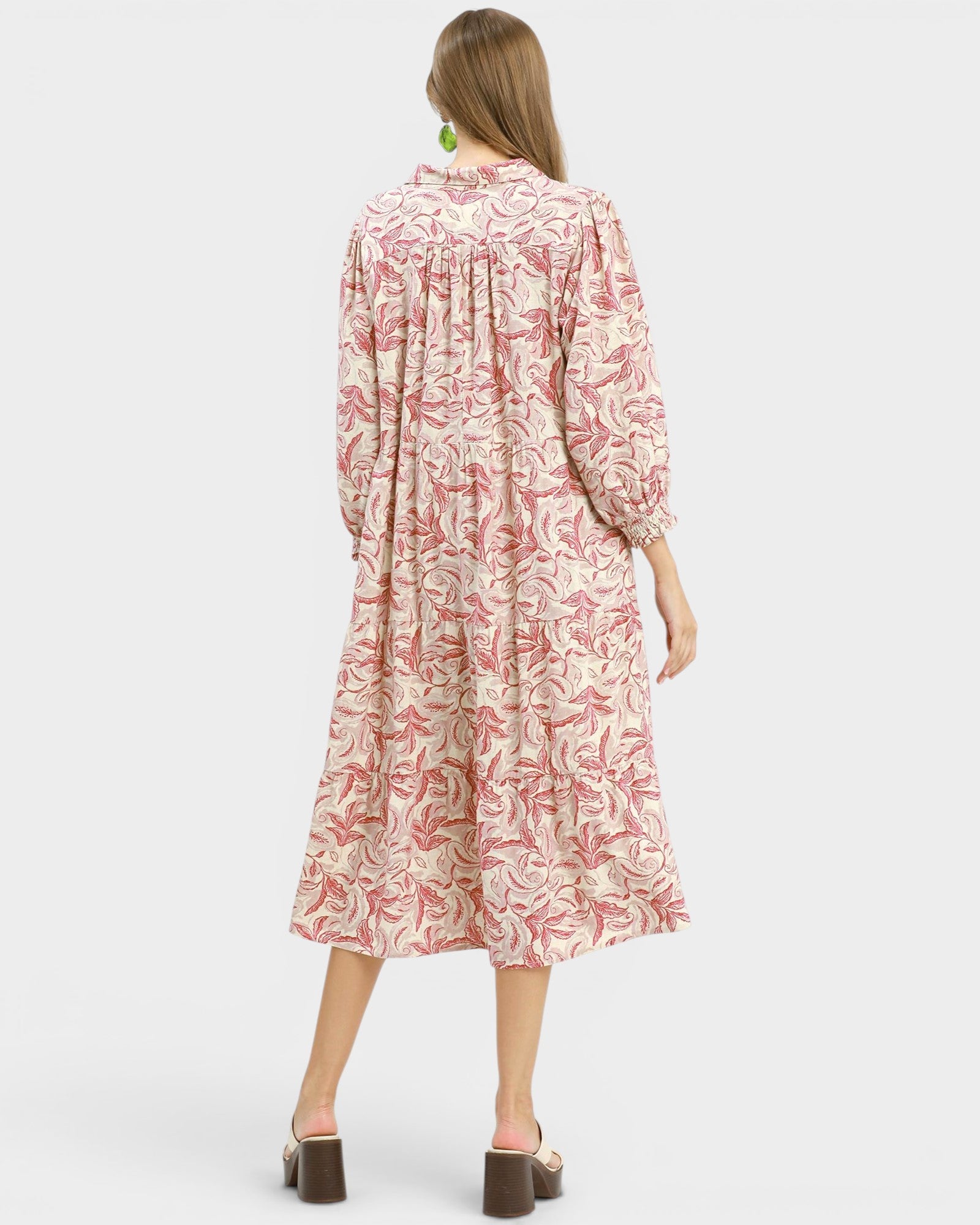 Woman wearing a floral dress on a white background