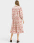 Woman wearing a floral dress on a white background