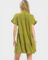 Green dress worn by a person on a white background