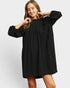 Woman wearing a black dress on a white background