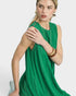Woman wearing a green sleeveless dress on a white background