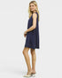Woman wearing a navy blue sleeveless dress on a white background