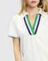 White polo shirt with colorful collar detail on a plain background