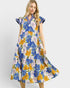 Woman wearing a colorful floral dress on a white background