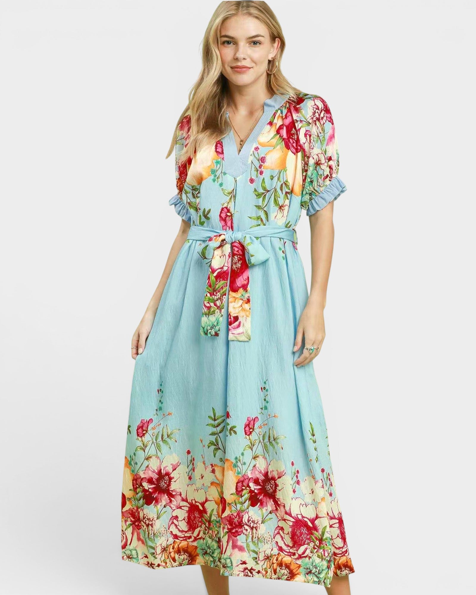 Woman wearing a floral dress with a white background