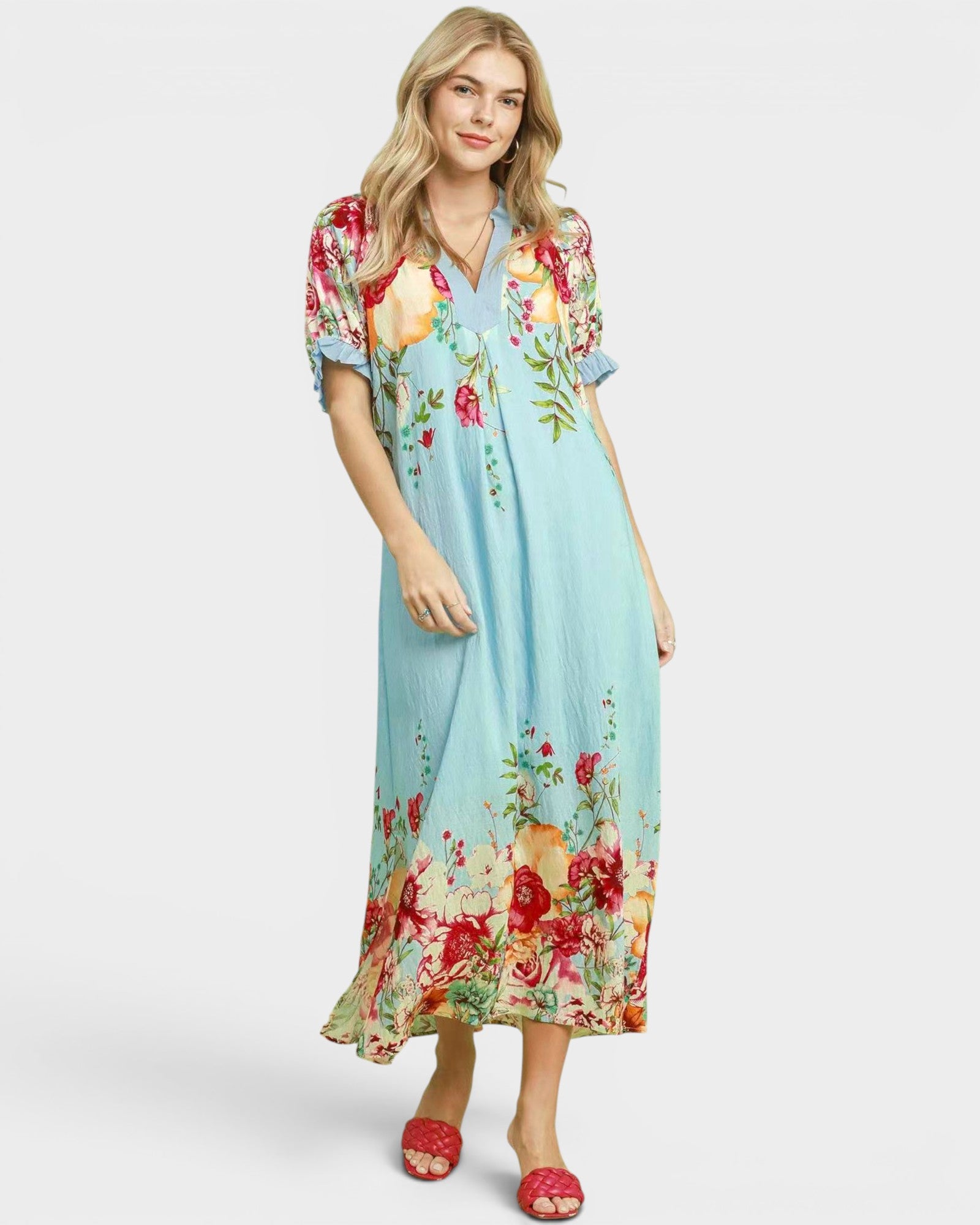 Woman wearing a floral dress on a white background