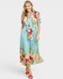 Woman wearing a floral dress with a white background