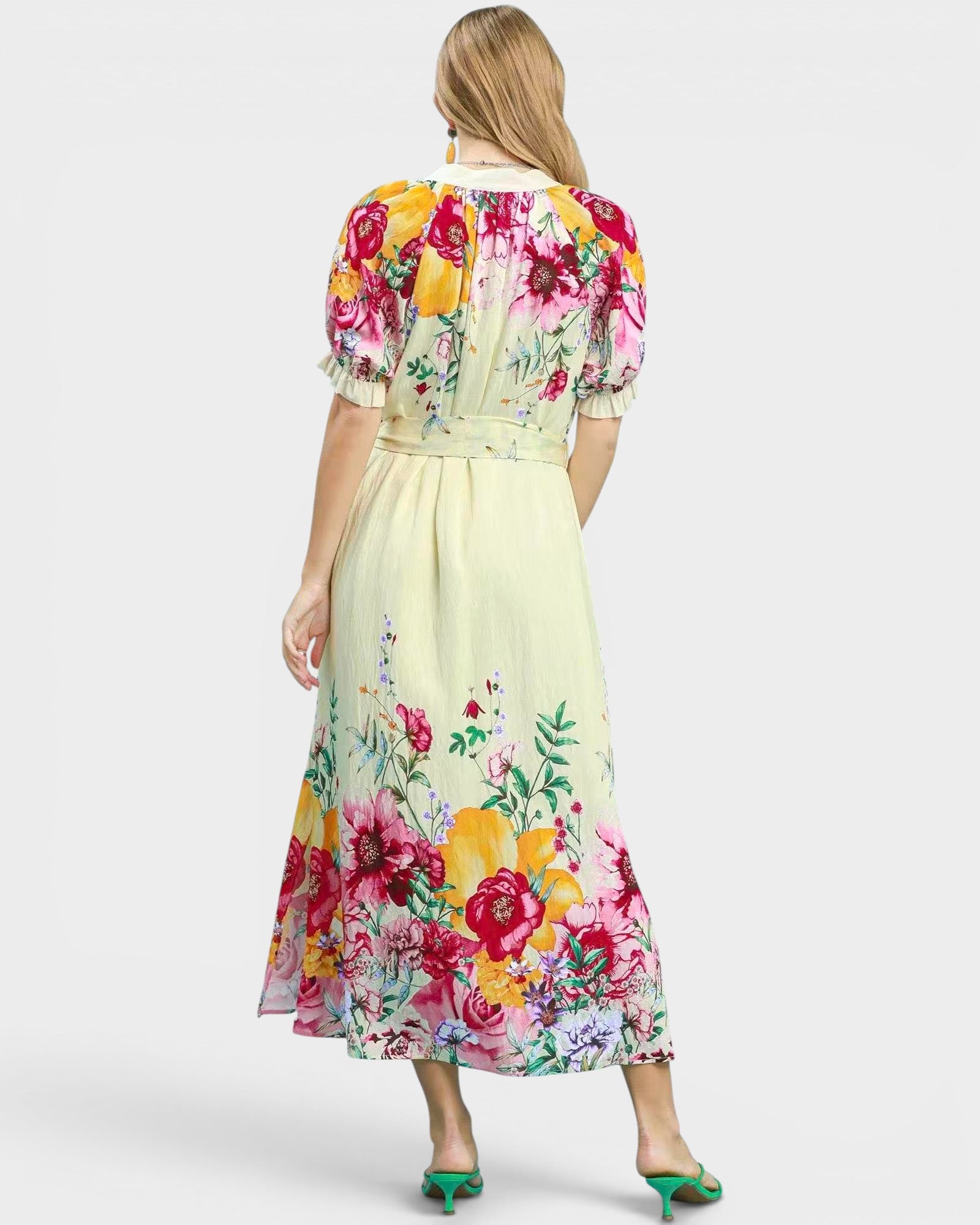 Woman wearing a floral dress with a white background
