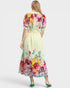 Woman wearing a floral dress with a white background