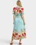 Woman wearing a floral dress with a white background