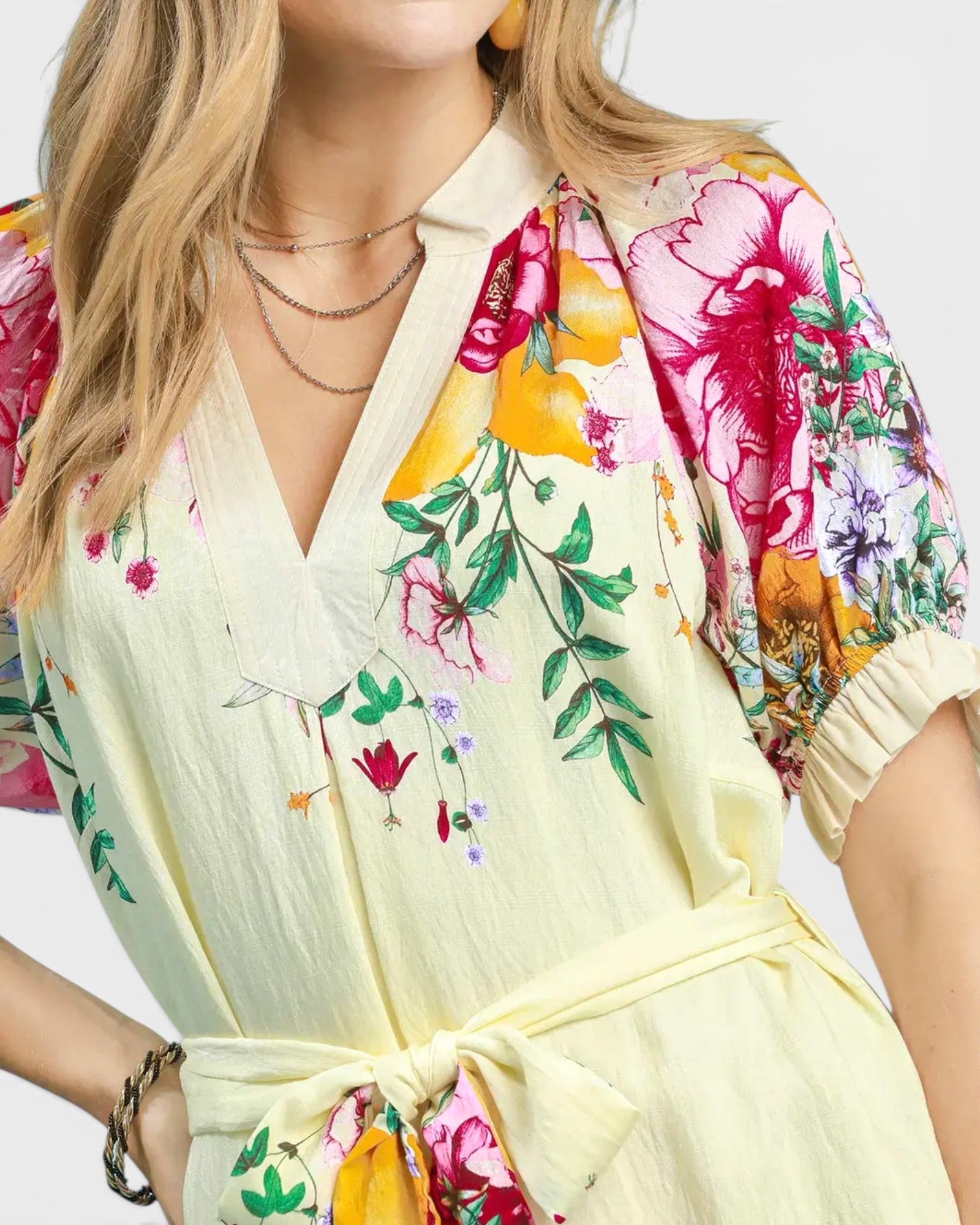 Woman wearing a floral dress with a white background