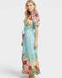 Woman wearing a floral dress with a white background