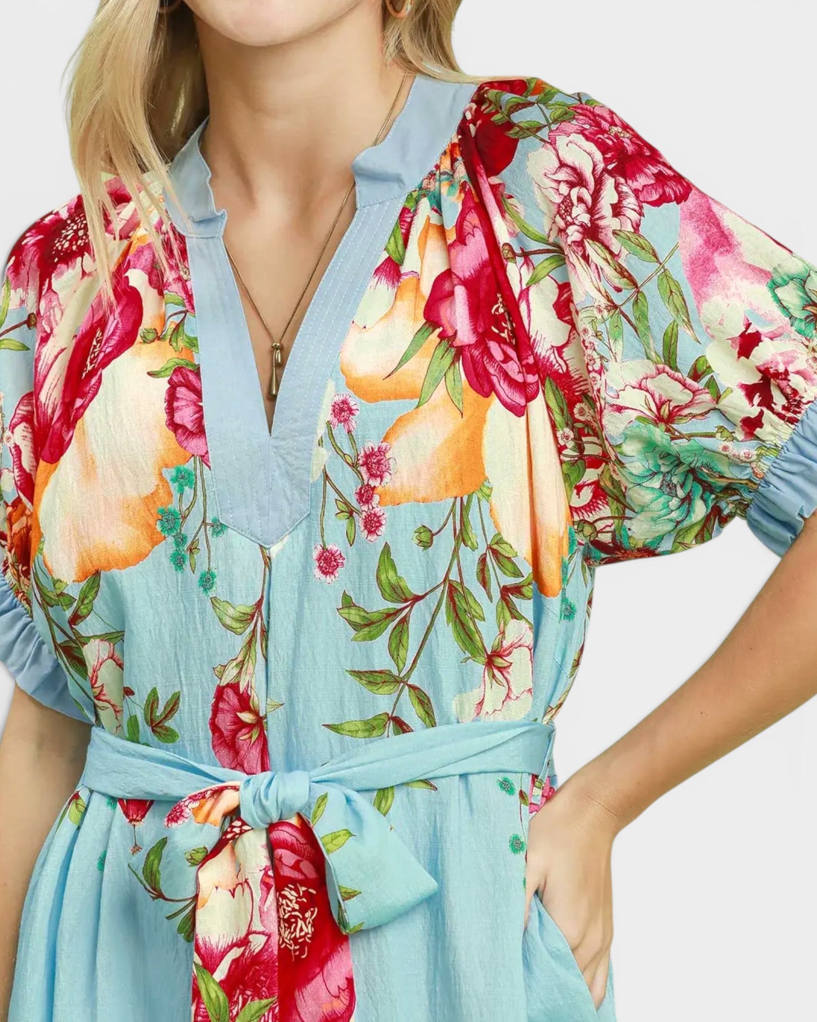 Colorful floral robe with a plain background