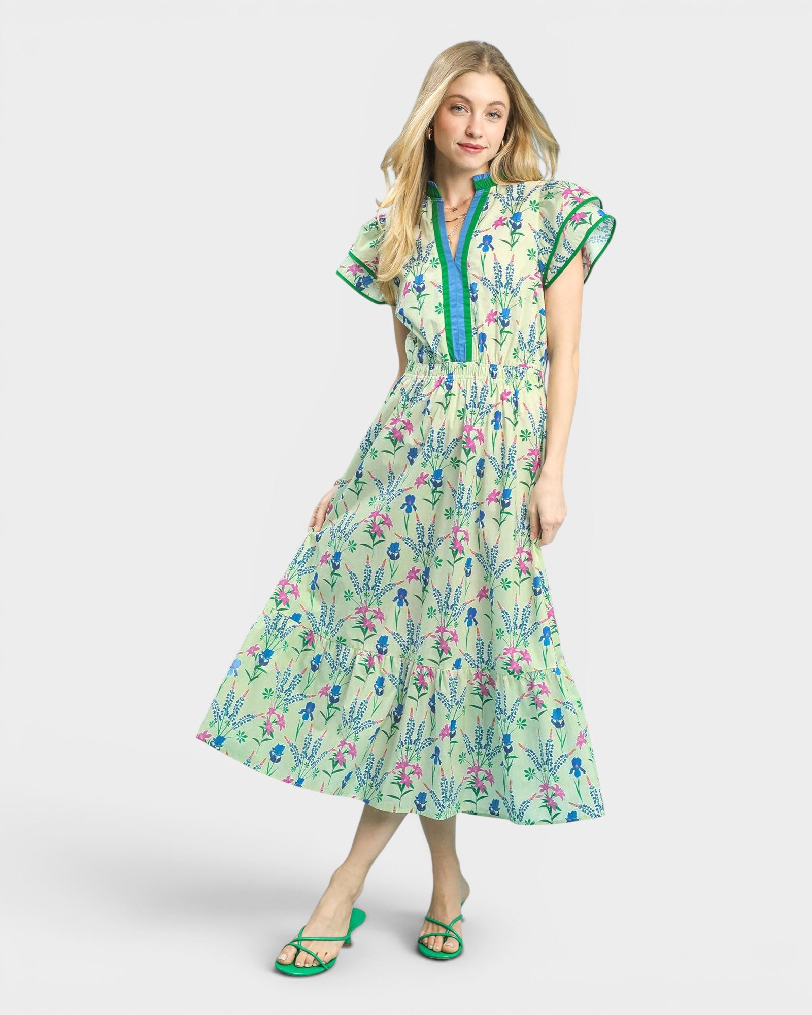Woman wearing a floral dress with a white background