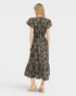 Woman wearing a floral dress on a white background