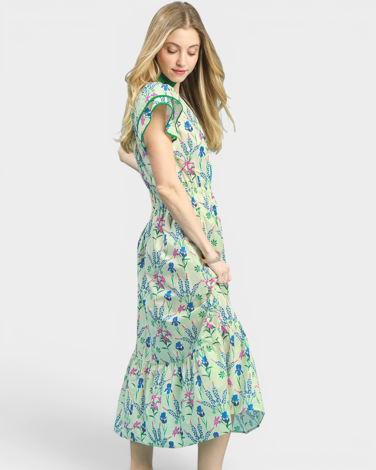 Woman wearing a floral dress on a white background