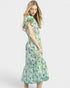 Woman wearing a floral dress on a white background