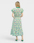 Woman wearing a floral dress on a white background
