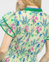 Woman wearing a floral dress with a white background