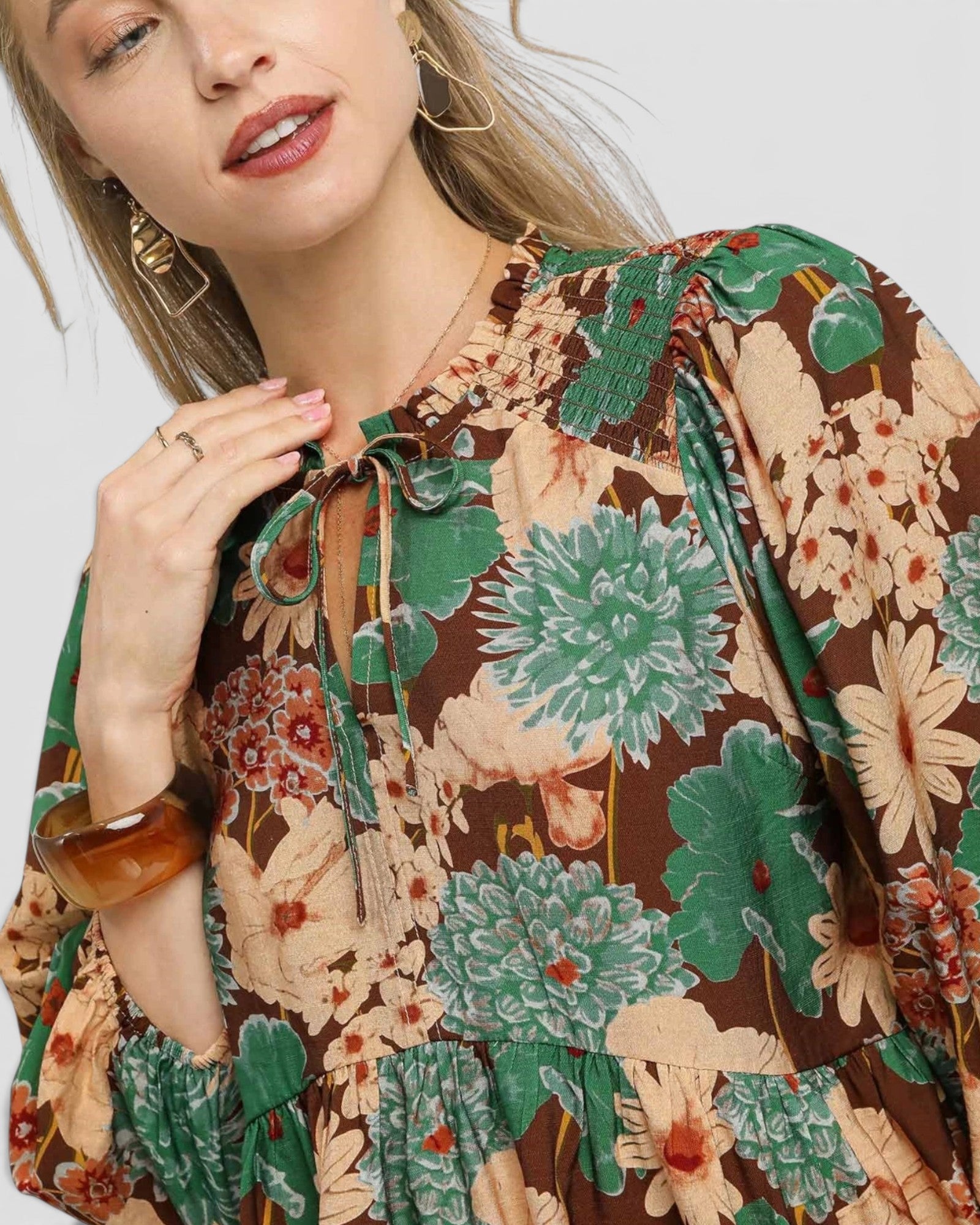 Woman wearing a floral dress with a white background