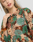 Woman wearing a floral dress with a white background