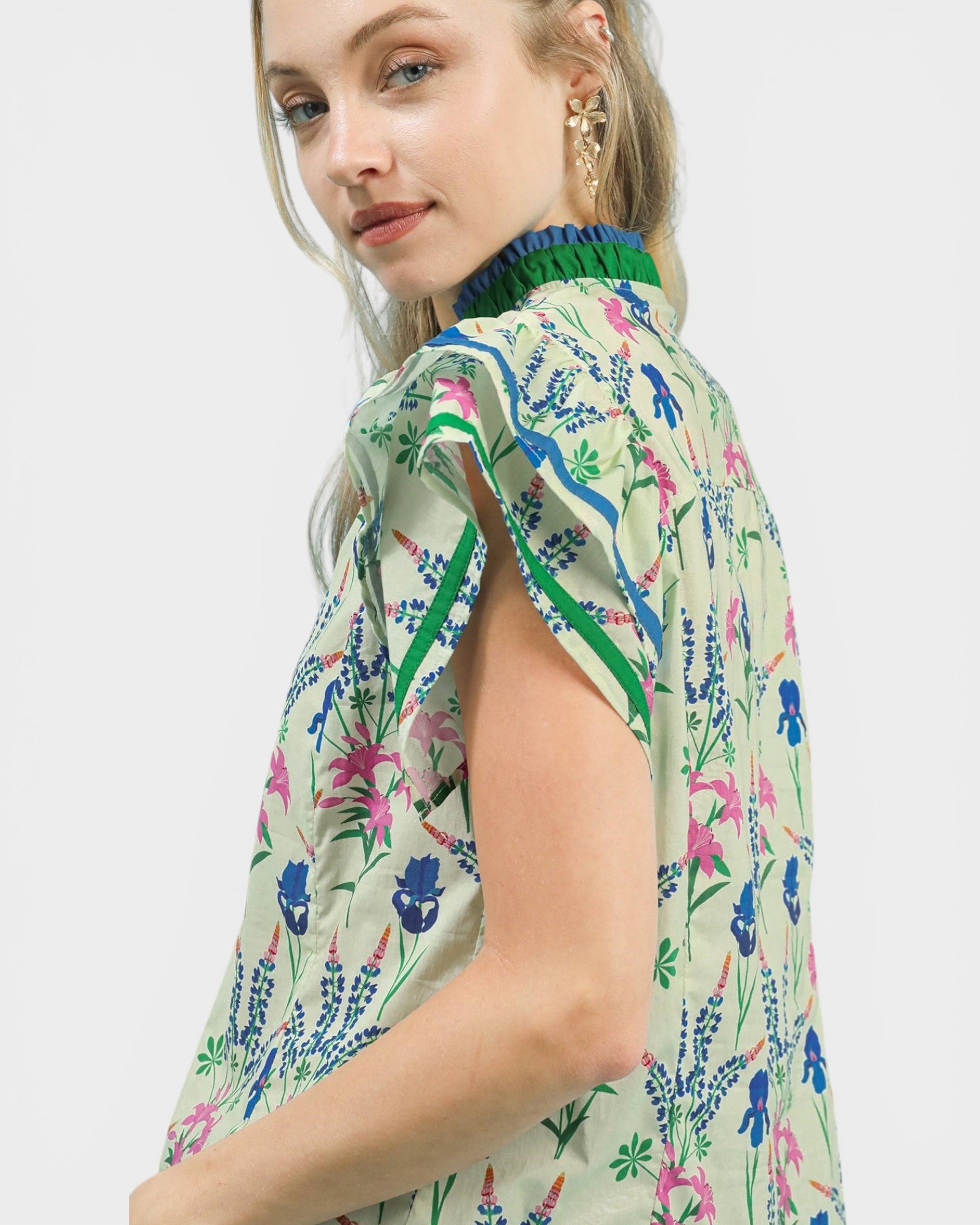 Woman wearing a floral dress with a white background