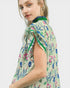Woman wearing a floral dress with a white background