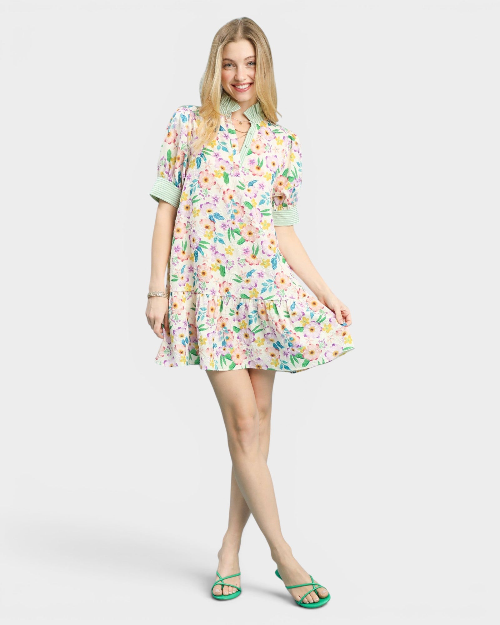 Woman wearing a floral dress on a white background