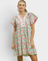 Woman wearing a floral dress against a white background