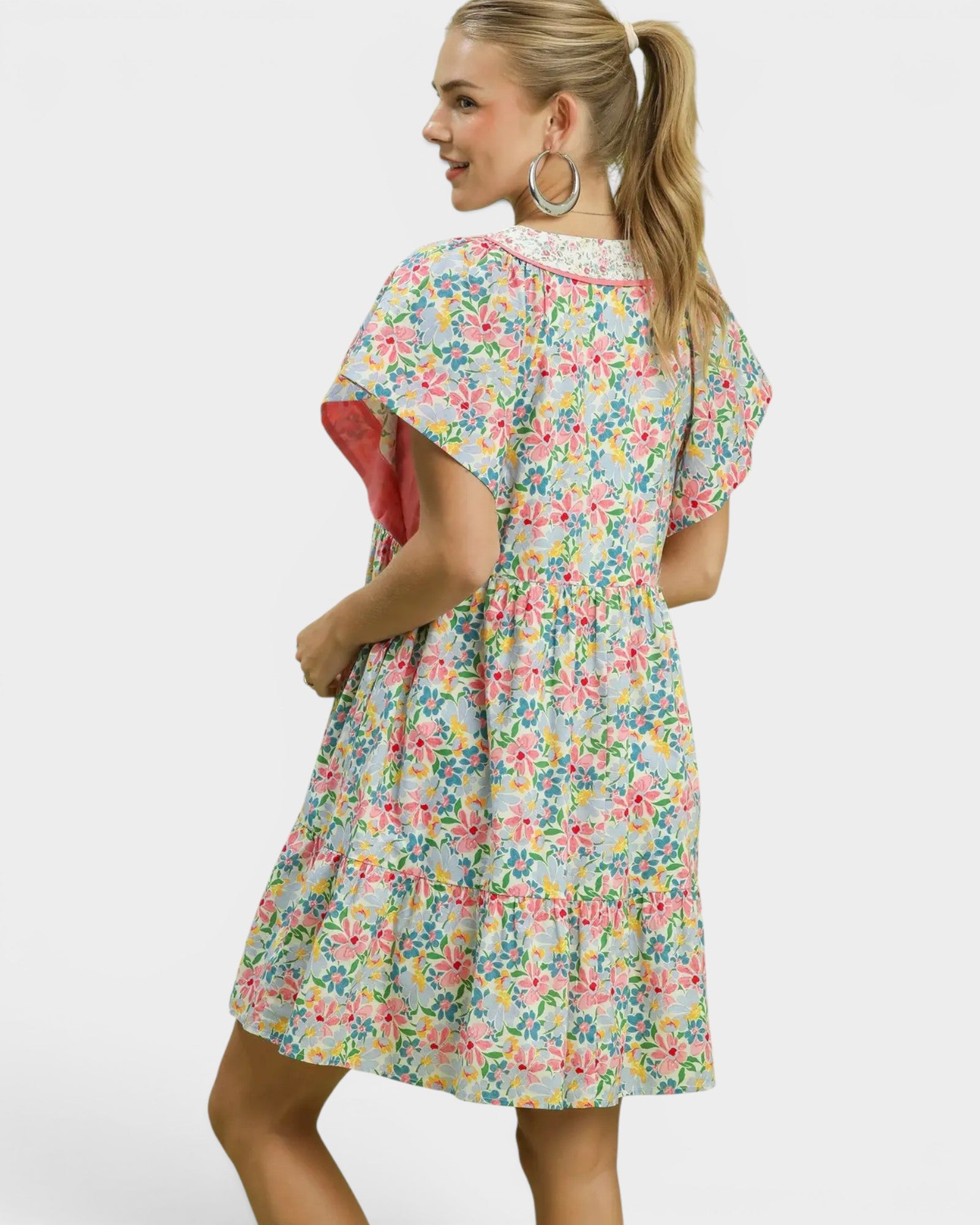 Woman wearing a floral dress on a white background