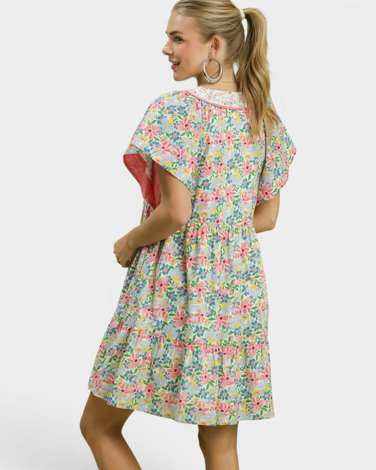 Woman wearing a floral dress on a white background