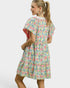 Woman wearing a floral dress on a white background