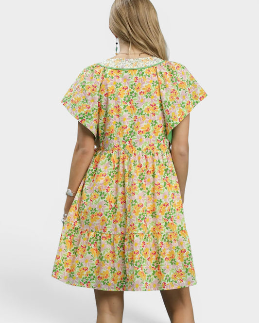 Woman wearing a floral dress on a white background
