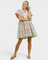 Woman wearing a floral dress on a white background