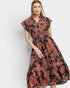 Woman wearing a floral dress on a white background