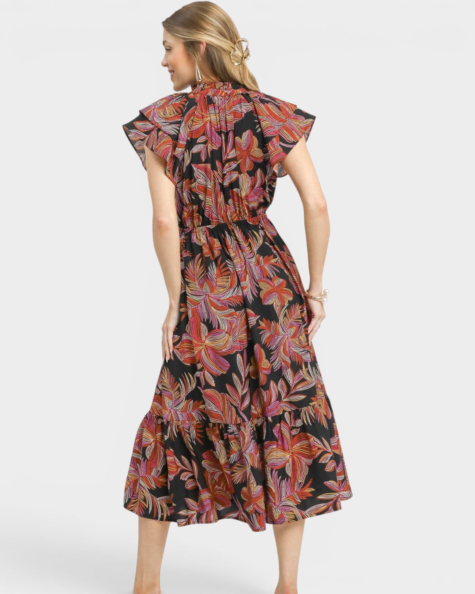 Woman wearing a floral dress on a white background