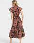 Woman wearing a floral dress on a white background