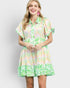 Woman wearing a colorful floral dress on a white background