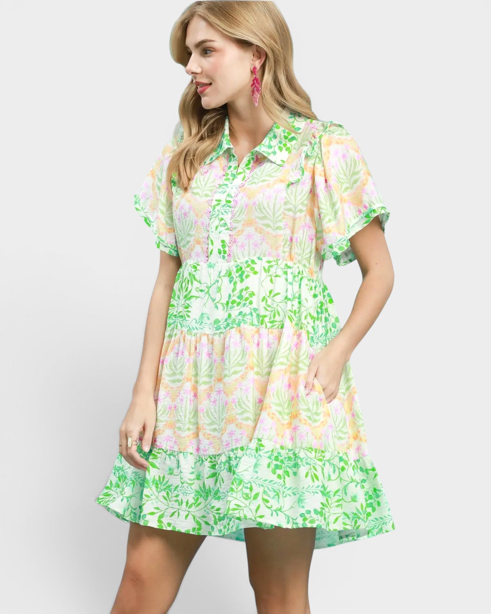 Woman wearing a floral dress on a white background