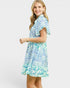 Woman wearing a floral dress on a white background