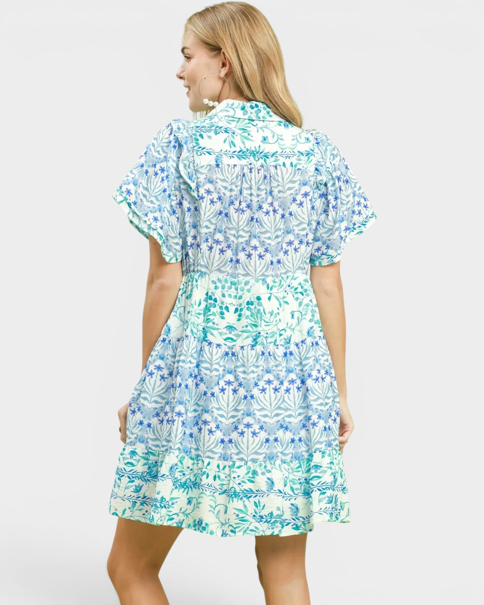 Woman wearing a floral dress on a white background